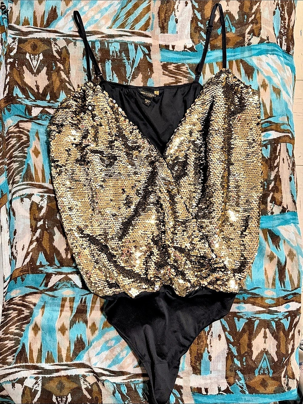 Gold Sequin bodysuit.
